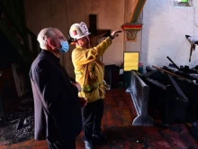 Archbishop Jose Gomez of Los Angeles visits the scene of the fire at San Gabriel mission, July 11, 2020